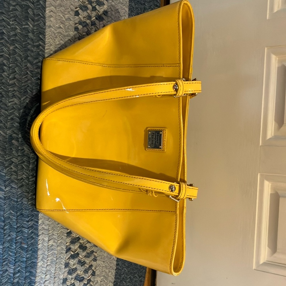 Dooney & Bourke yellow ladies shoulder bag.
